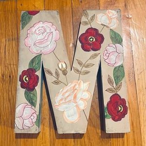 Hand painted decorative “M” inital decor. Free standing or wall hanging
